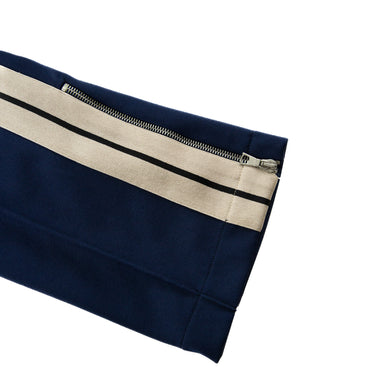 The cuff of the Palm Angels Navy Embroidered Logo Sweatpants.