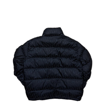 The back of the Dior Oblique Navy Down Puffer Jacket.