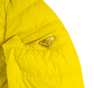 The logo of the Prada Milano Yellow Puffer Jacket.