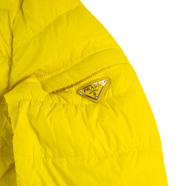 The logo of the Prada Milano Yellow Puffer Jacket.