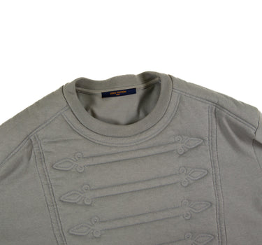 The collar and pattern of the Louis Vuitton Embroidered Plastron T-Shirt.