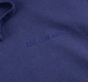 The logo of the Aimé Leon Dore Logo Navy Hoodie.