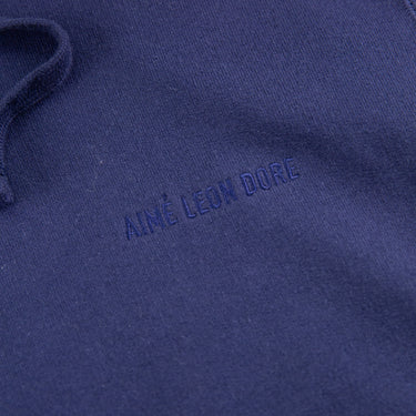 The logo of the Aimé Leon Dore Logo Navy Hoodie.