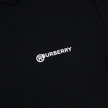 The front logo of the Burberry Location Black Polo Shirt.