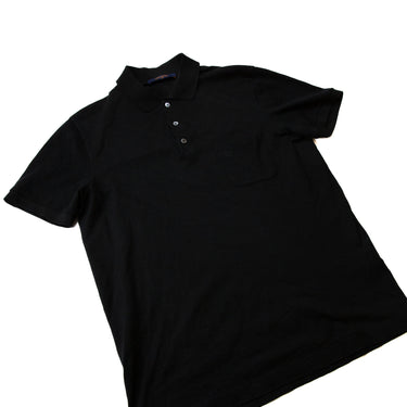 The flatlay of the Louis Vuitton Black Polo Shirt.