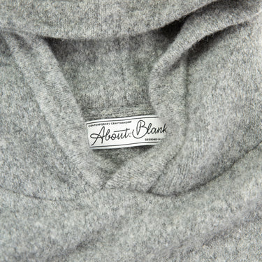 The collar of the about:blank Mohair Knitted Logo Grey Hoodie.