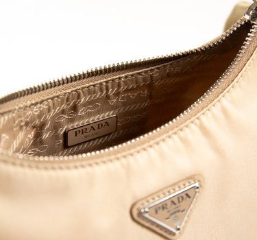 The logo of the Prada Beige Nylon Shoulder Bag.