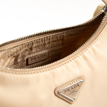 The logo of the Prada Beige Nylon Shoulder Bag.