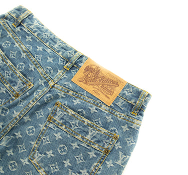 The logo of the Louis Vuitton Monogram Denim Jeans.