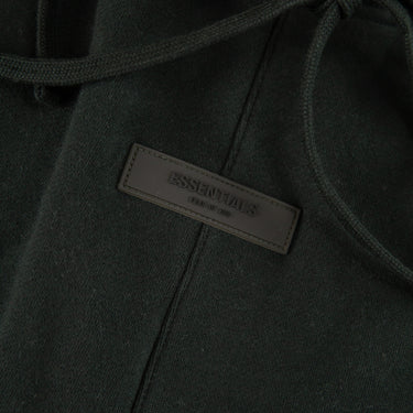 The front label of the Fear Of God ESSENTIALS Stretch Limo Sweatpants.