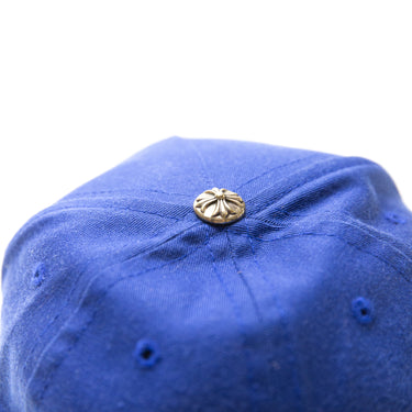 The logo of the Chrome Hearts Blue Trucker Hat.