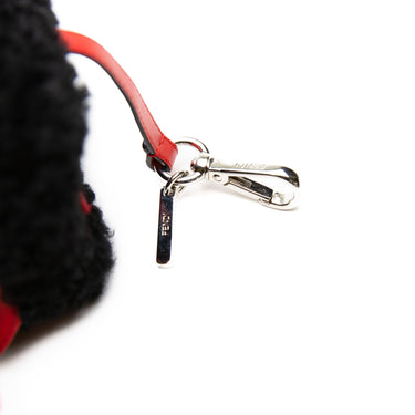 The clasp on a Fendi Dice Box Bag in Black & Red.